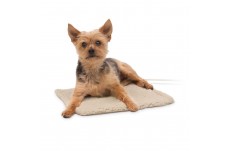 Tan small pet bed heater cover with a dog lying on the mat