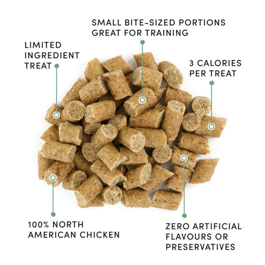 Small bite-sized chicken dog treat pieces, shown in a pile