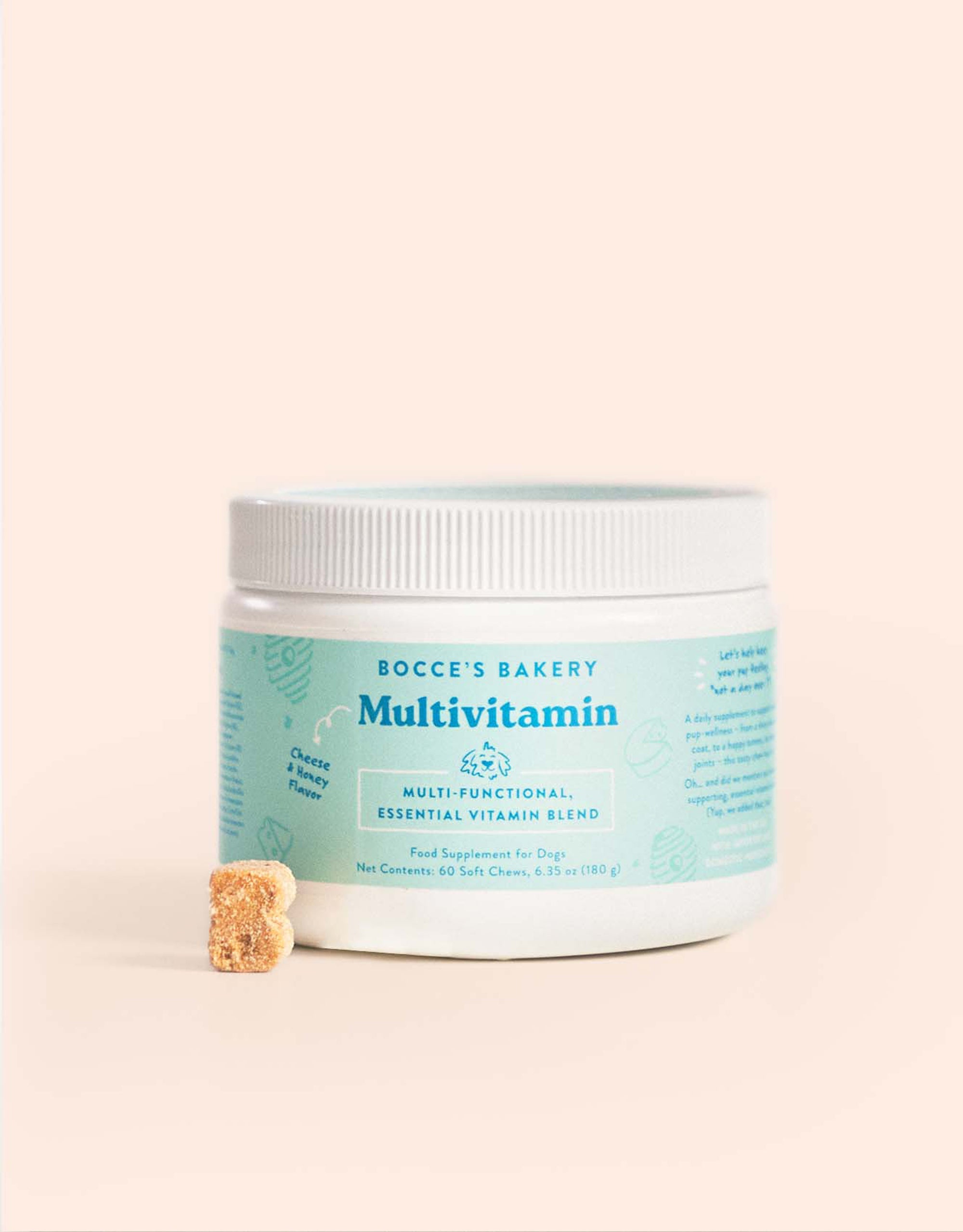 Bocce's Bakery dog multivitamin jar on light background with small chew piece